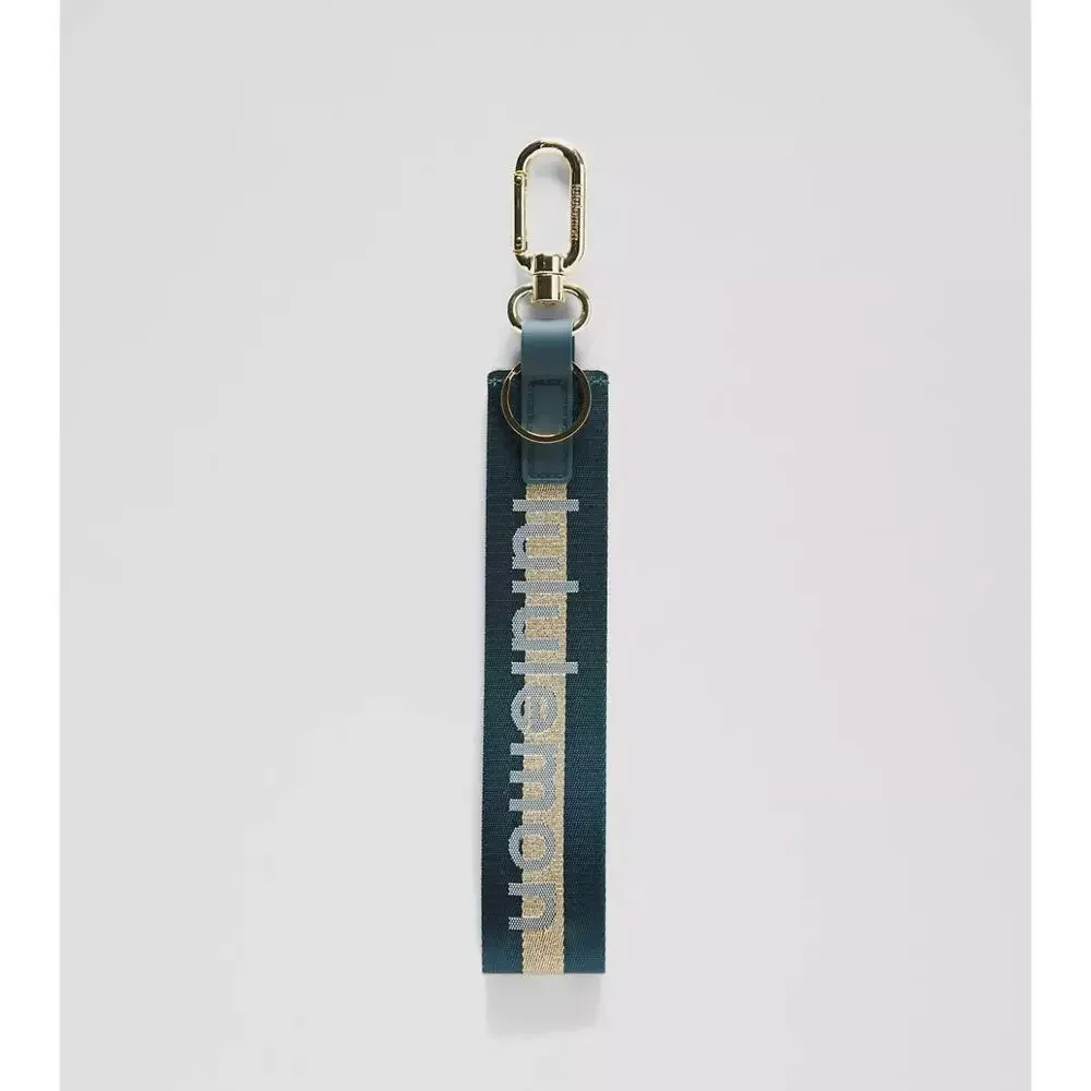 NEW Lululemon Never lost Keychain Wordmark Warp Teal Gold Blue